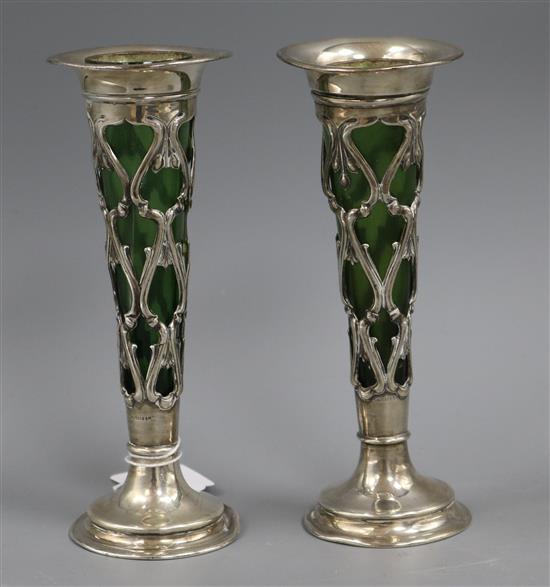 A pair of Edwardian Art Nouveau pierced silver posy vases with green glass liners, William Mammatt & Son, Sheffield, 1907, one glass a.